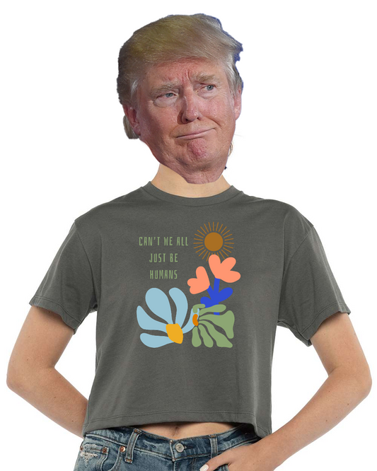 Person wearing a mask with a printed t-shirt featuring floral designs and text.